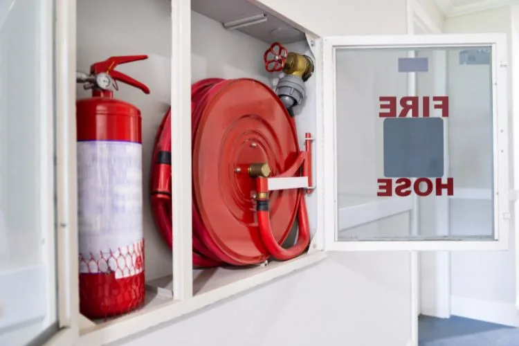 Fire Extinguisher and Hose in an Apartment Building